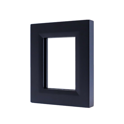 A black rectangular frame with a beveled inner edge, angled against a white background
