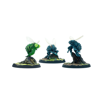 Three painted miniatures of fly-like creatures: one green, two blue-teal, standing and crouching on detailed bases