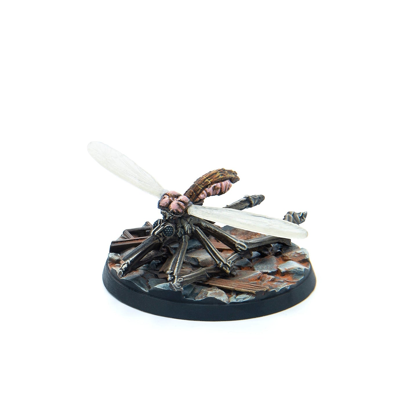 A miniature grotesque insectoid creature with a brown segmented body, pink flesh, clear wings, and dark legs, on a debris base
