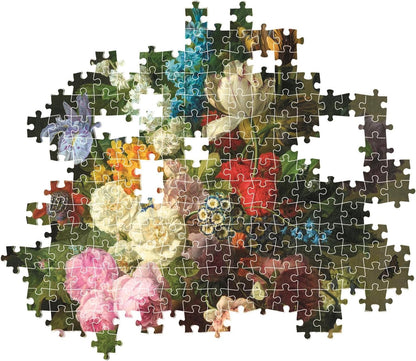 An incomplete jigsaw puzzle depicting a classical floral still life, with vibrant flowers and visible gaps