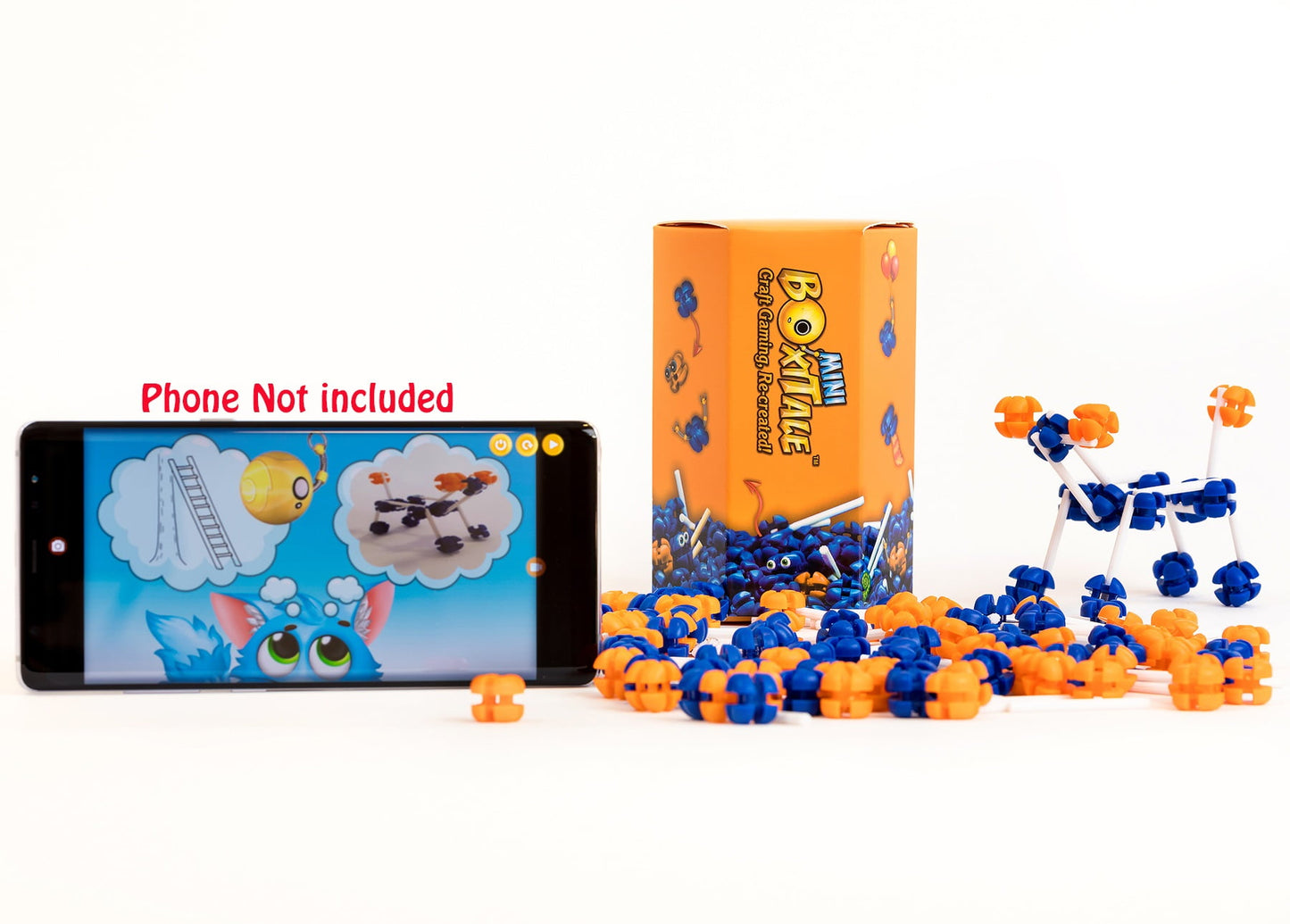 Scattered blue/orange pieces, an assembled figure, box, and a phone displaying its game (phone not included)