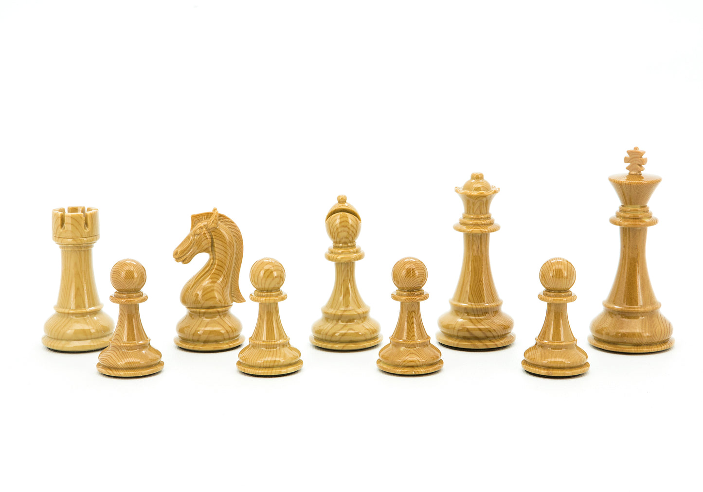 Nine light wooden chess pieces: Rook, Knight, Bishop, Queen, King, and four Pawns, lined up on a white background