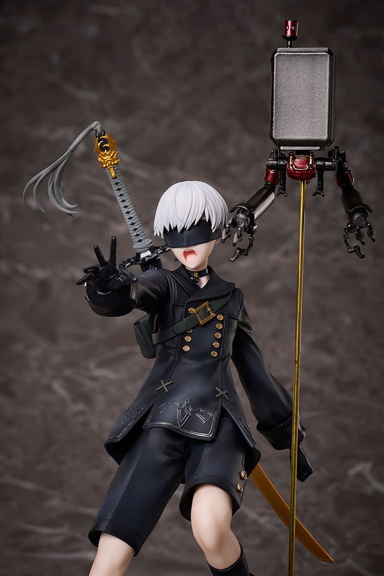 Blindfolded 9S figure from NieR: Automata in black uniform, making a V-sign, with katana and Pod