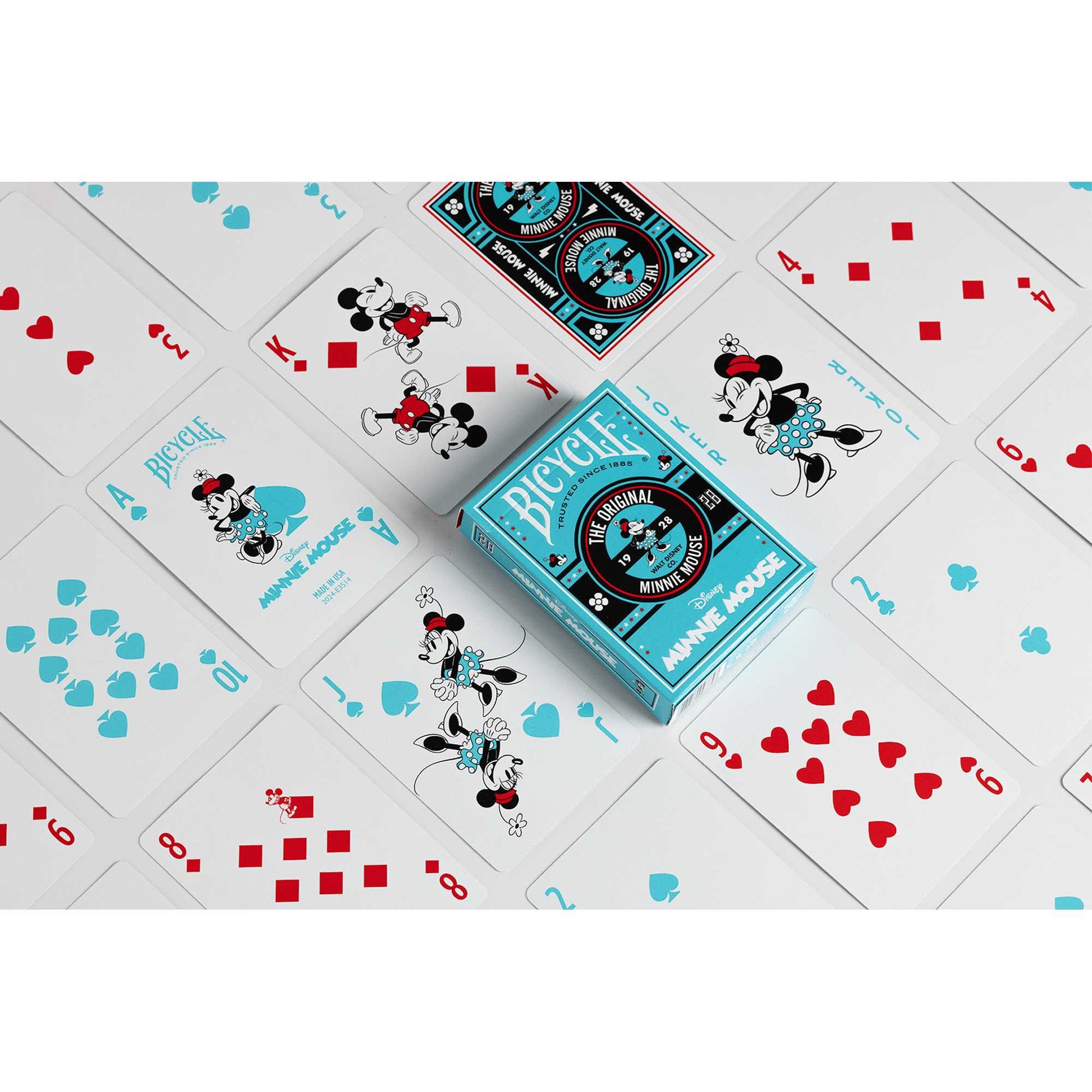 Minnie Mouse Disney Bicycle playing cards and turquoise deck box, displayed scattered
