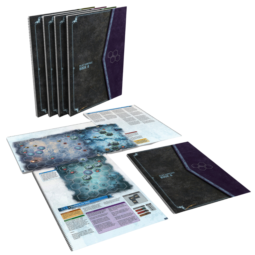 Top-down view of the Frosthaven Play Surface Books laid open, displaying printed scenario maps and included destroyed obstacle tokens