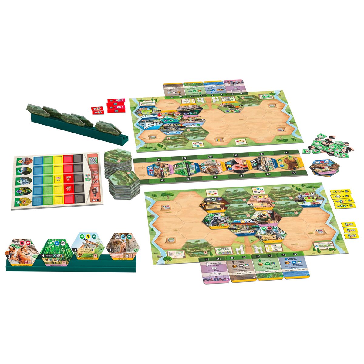 Tabletop strategy board game components laid out, showing modular maps, animal tiles, cards, and resource trays