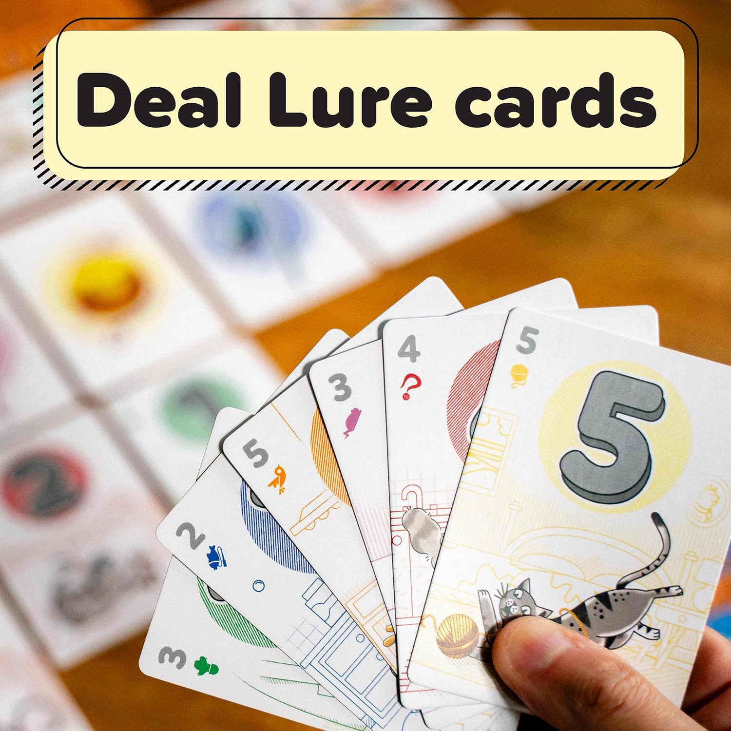 Hand holding a fan of numbered game cards, overlaid with the text: "Deal Lure cards"