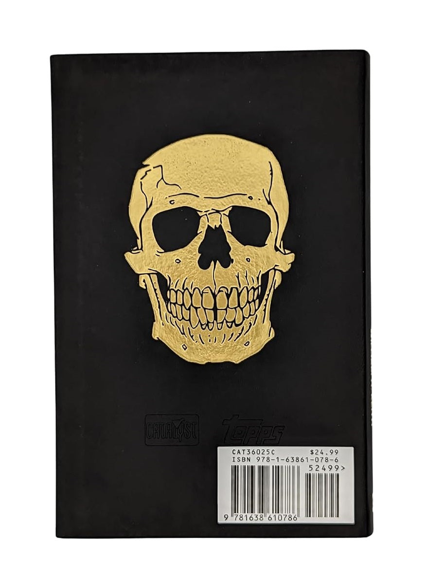 Black book cover with a large gold skull design. A barcode and price tag are at the bottom right.