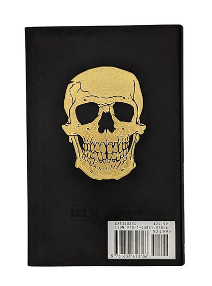 Black book cover with a large gold skull design. A barcode and price tag are at the bottom right.