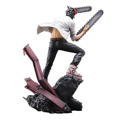 Chainsaw Man figure in a dynamic action pose, featuring a chainsaw head and arm blades, on a rocky base