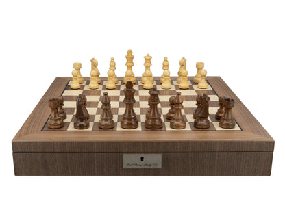 Wooden chessboard with light and dark pieces set up, on a storage box with a "Dal Rossi Italy" plaque