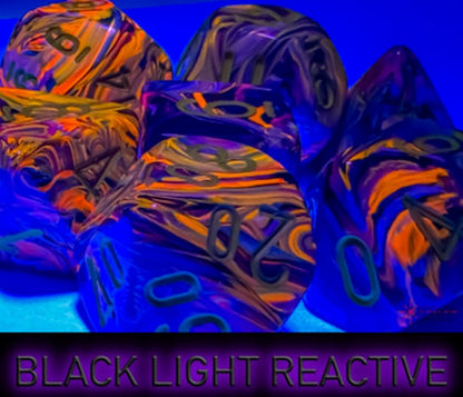 Vibrant, swirled purple, orange, and yellow polyhedral dice glowing under black light