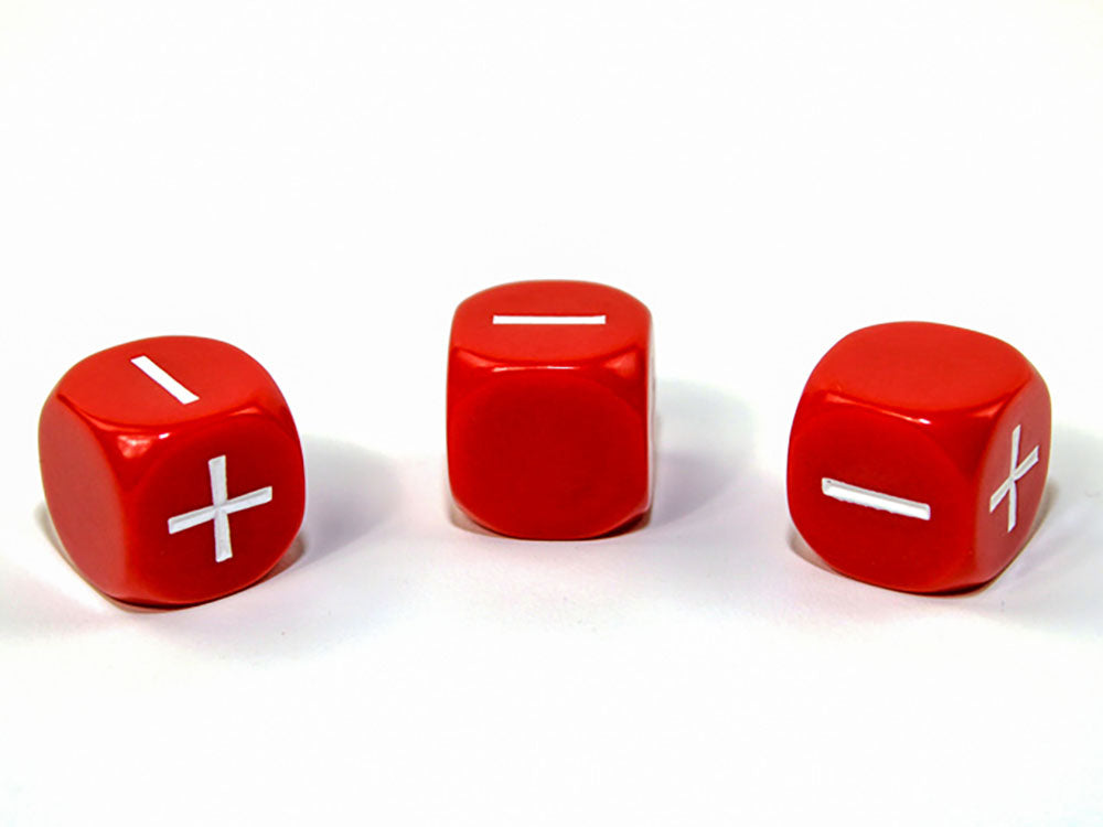 Three red fudge dice: one shows plus and minus, two show only minus, on a white background