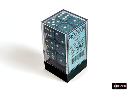 A clear plastic box holds a Chessex 12-dice block of speckled sea-green d6 dice with white pips