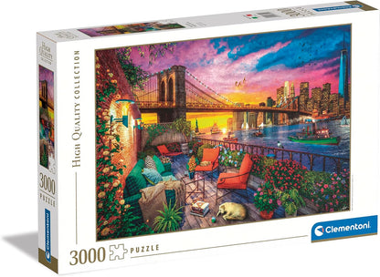 A 3000-piece puzzle box showing a vibrant Manhattan sunset scene with Brooklyn Bridge, city skyline, and a cozy terrace with pets