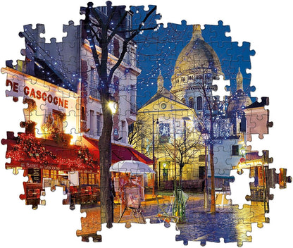 Puzzle image: Night scene in Paris with Sacré-Cœur, a cafe, trees with string lights, and reflections on wet ground