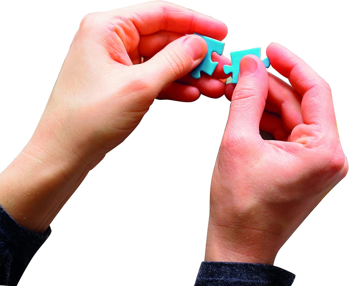 Hands connecting two bright turquoise puzzle pieces