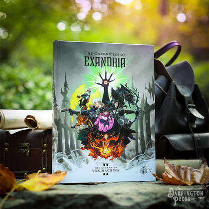 Fantasy book 'Chronicles of Exandria II' shows heroes, a glowing hand, and fire. Set outdoors with backpack and leaves