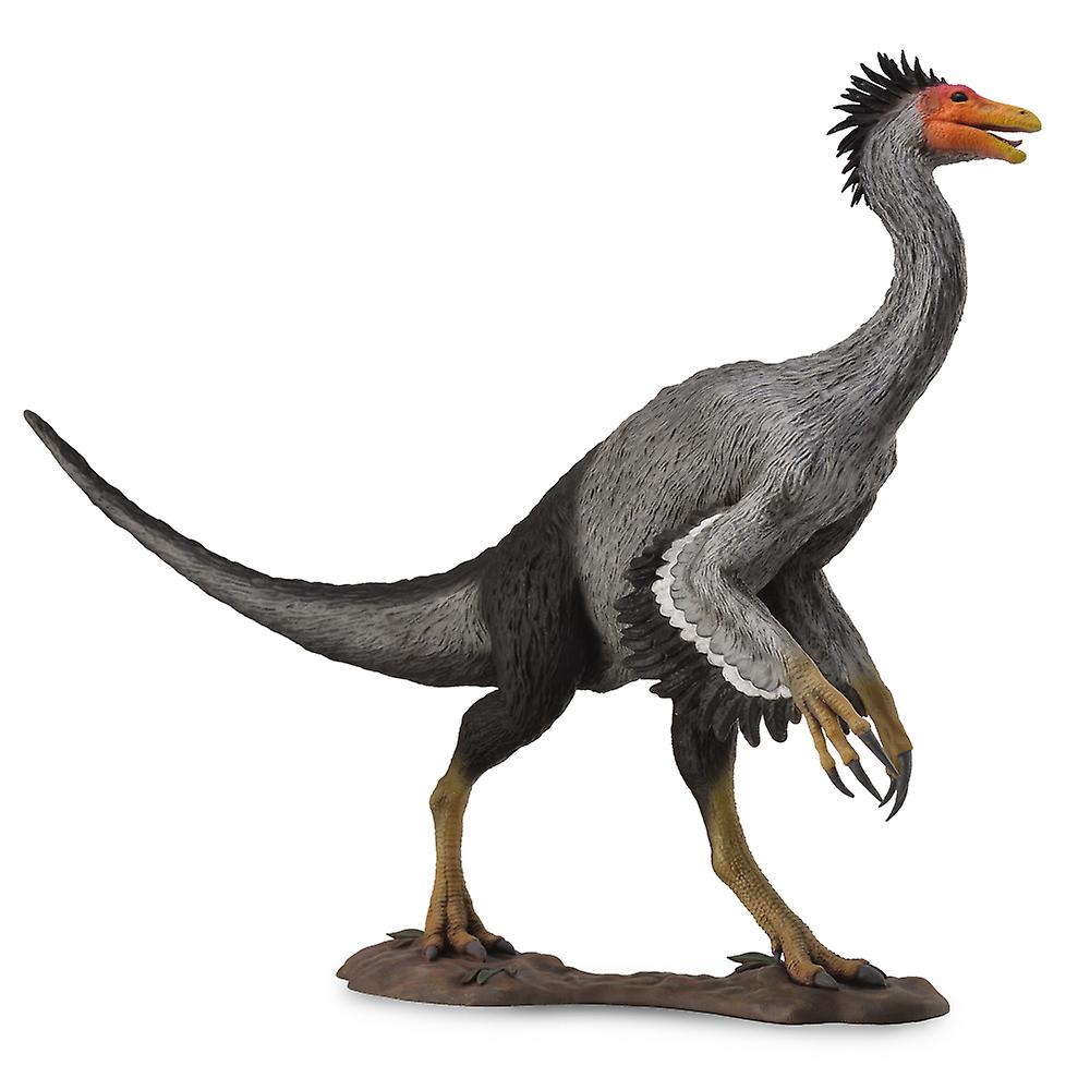 A gray feathered dinosaur model with an orange head, yellow beak and spiky crest stands on a brown base