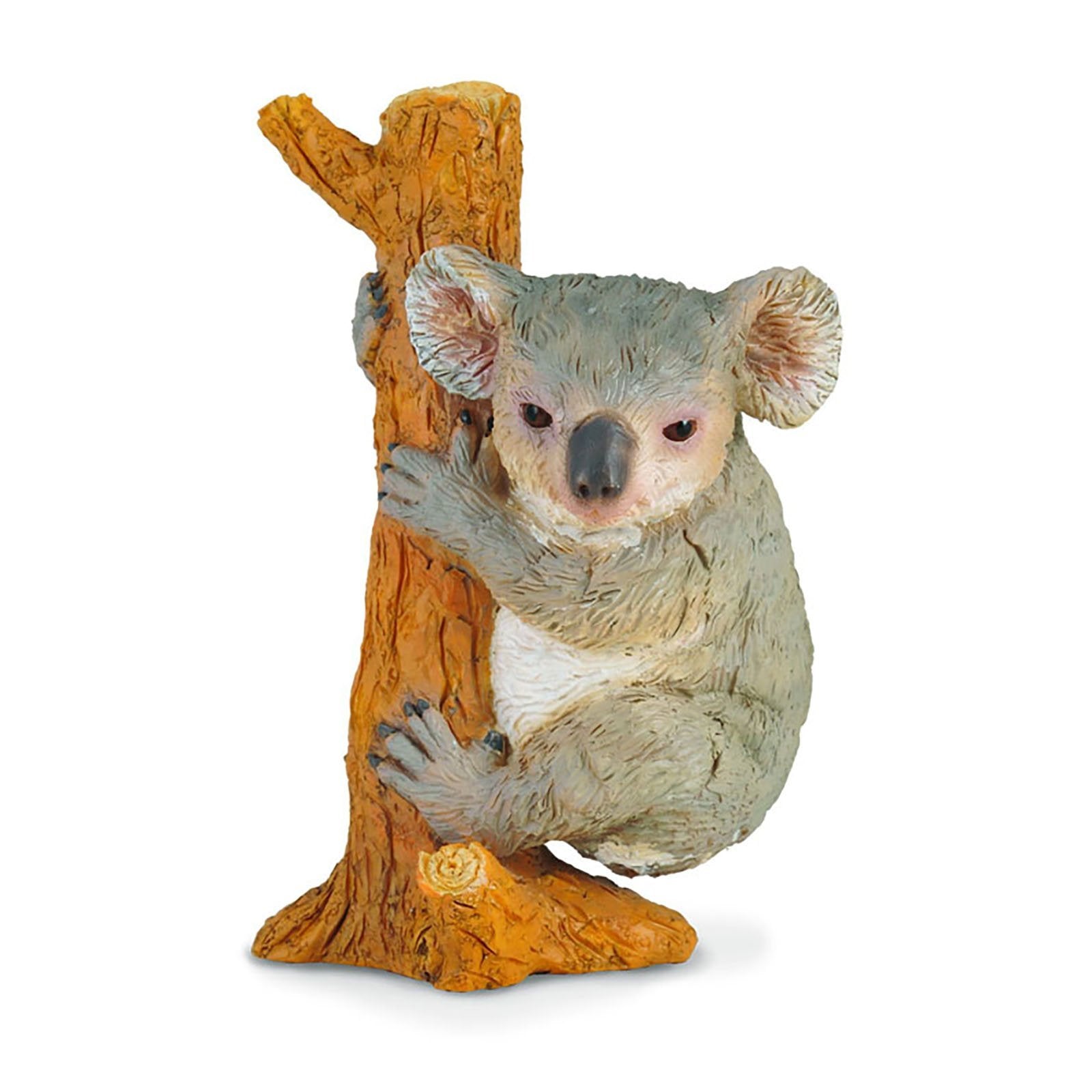 A gray koala figurine with a white belly clings to a textured orange tree trunk, looking forward