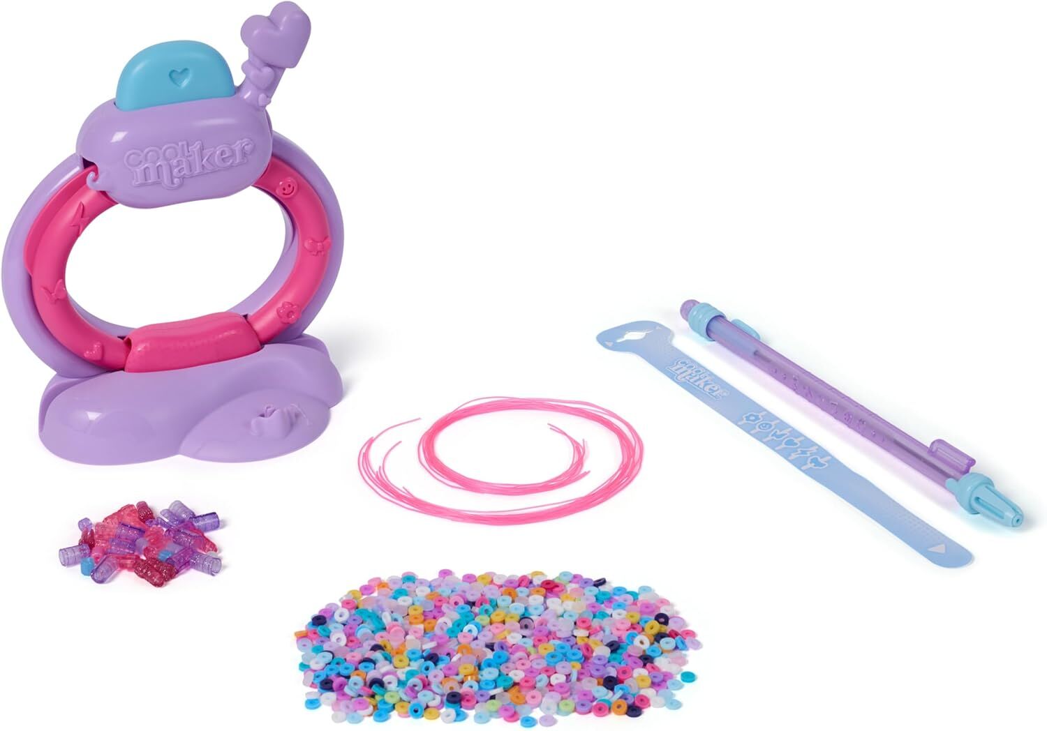Cool Maker bracelet kit: purple and pink machine, pink string, piles of colorful small and translucent large beads, purple bead threading tool, and blue ruler