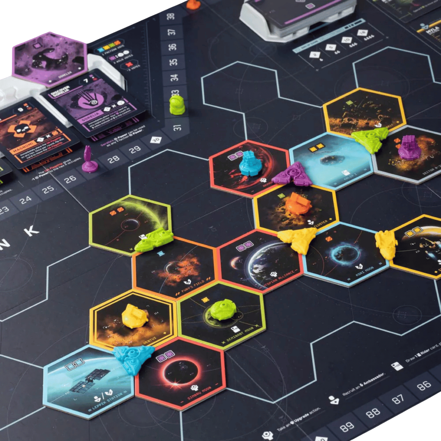Close-up of a board game setup with hexagonal space tiles, colourful tokens, and game cards