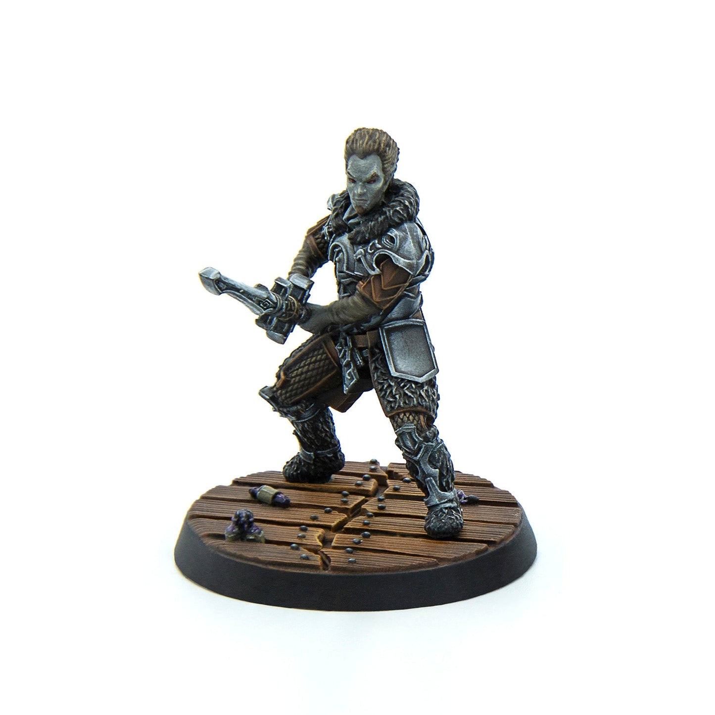 Painted miniature of a grey-skinned warrior with red eyes in ornate armor, wielding a crossbow on a wooden base