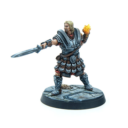 Blond warrior miniature in segmented armor, wielding a sword and fiery orb, posed on a stone base