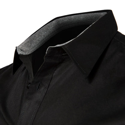 Close-up of a black dress shirt with a grey-lined collar, partially unbuttoned. White background