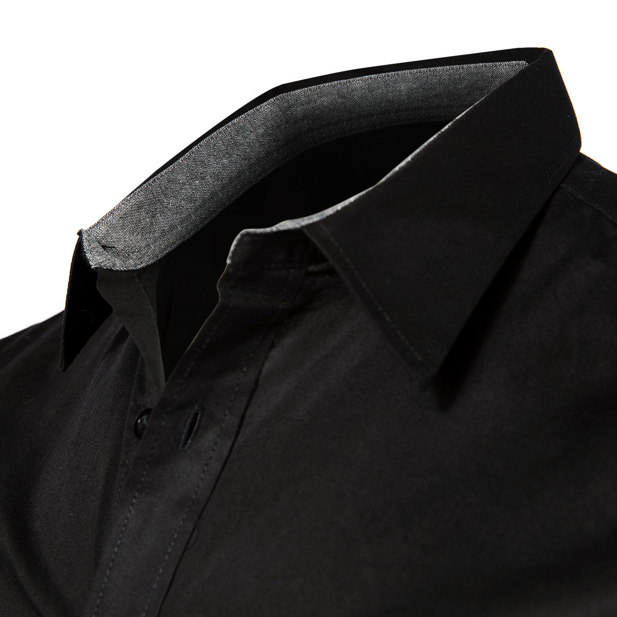 Close-up of a black dress shirt with a grey-lined collar, partially unbuttoned. White background