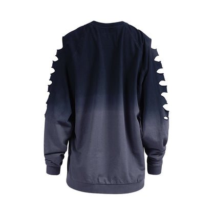 A dark blue-grey ombre long-sleeve top, back view, with tear-shaped cutouts along both sleeves