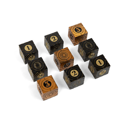 Nine black and bronze dice with gold numbers and intricate patterns, scattered on a white background