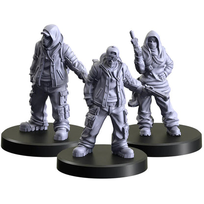 Three grey unpainted miniature figures on black bases, wearing tactical gear with obscured faces