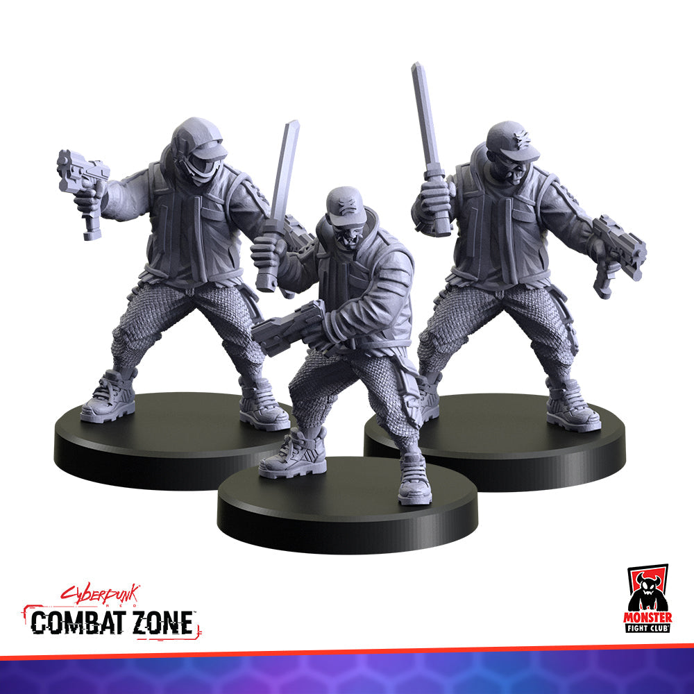 Three unpainted gray cyberpunk miniatures on bases, armed with pistols and blades, posed dynamically for combat