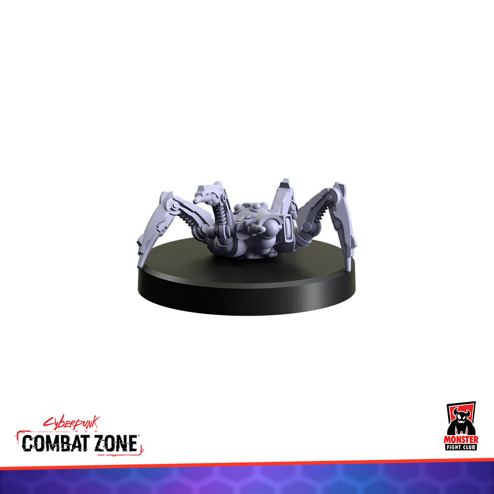 A grey robotic spider miniature with segmented mechanical legs, on a black circular base