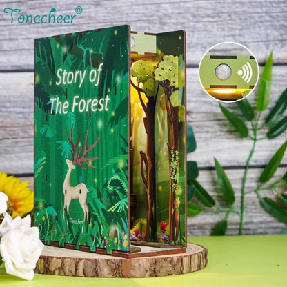 An open wooden book titled "Story of The Forest" displays an illuminated forest diorama with a deer. Sensor detail