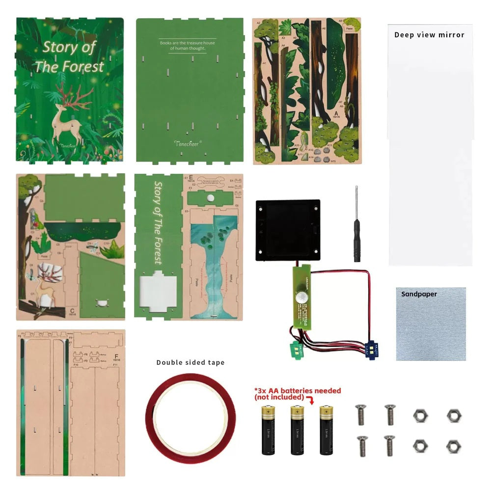 Components for a "Story of The Forest" DIY book nook kit, including printed wood pieces, electronics, and tools