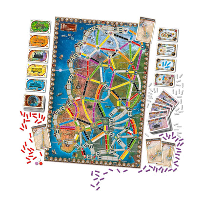 Overhead view of the Ticket to Ride board game (Nordic map) with train cards and scattered plastic track pieces