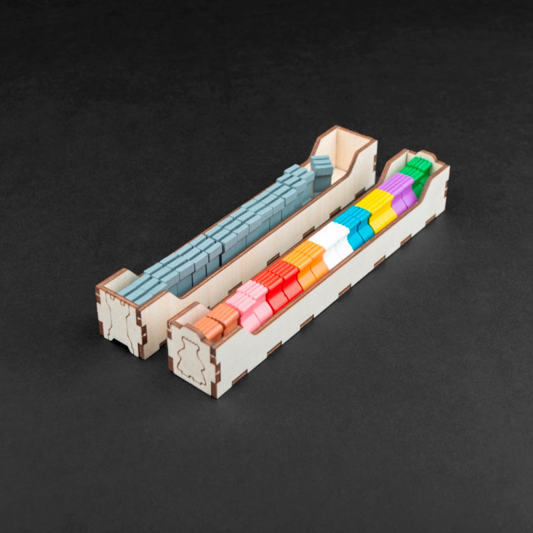 Wooden insert with dedicated spaces for Kingdomino game pieces