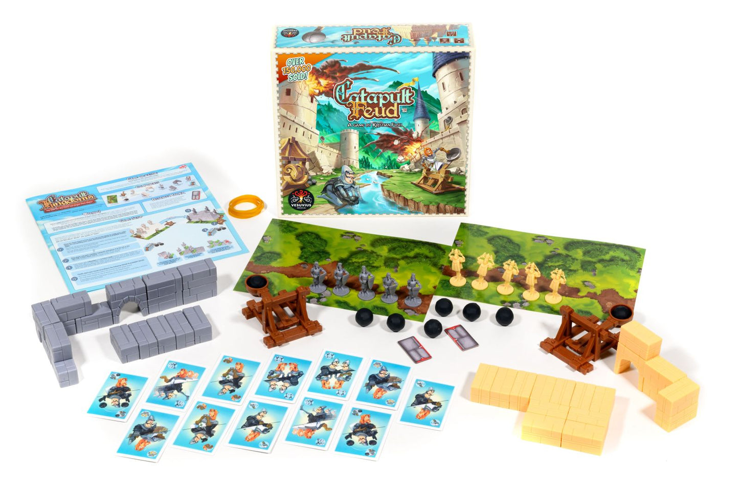 Catapult Feud board game components: two catapults, opposing armies of figures, building blocks, cards, and game board