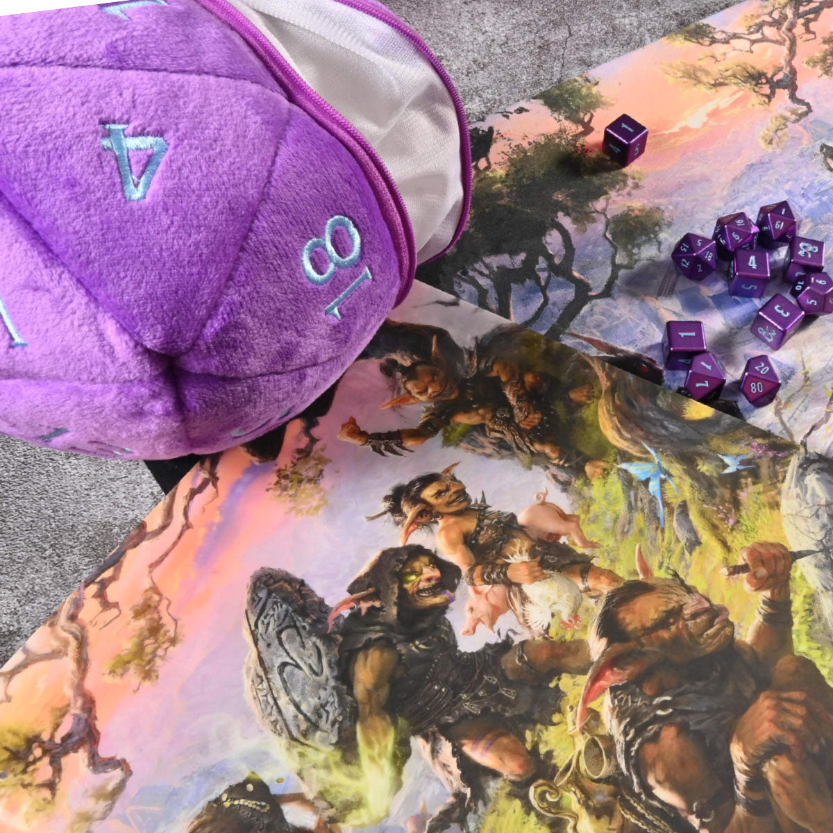 A plush purple D20 dice bag, scattered purple polyhedral dice, and a fantasy battle map showing goblins