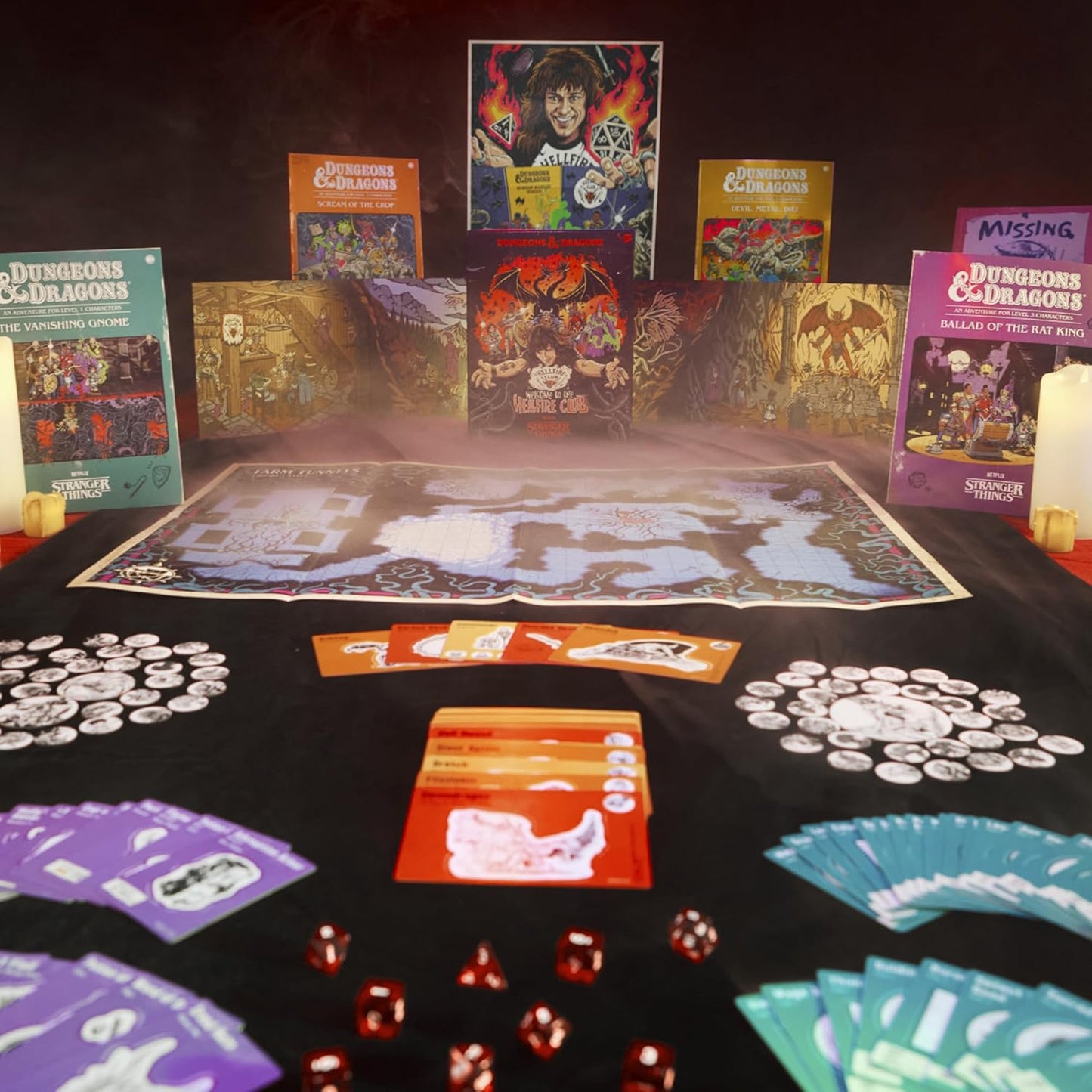 A tabletop Dungeons & Dragons Stranger Things game setup with books, a map, cards, dice and tokens