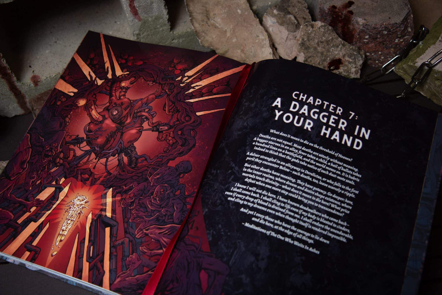 Open book, Chapter 7: A Dagger In Your Hand. Left page has red, visceral illustration of monstrous figures and a glowing dagger