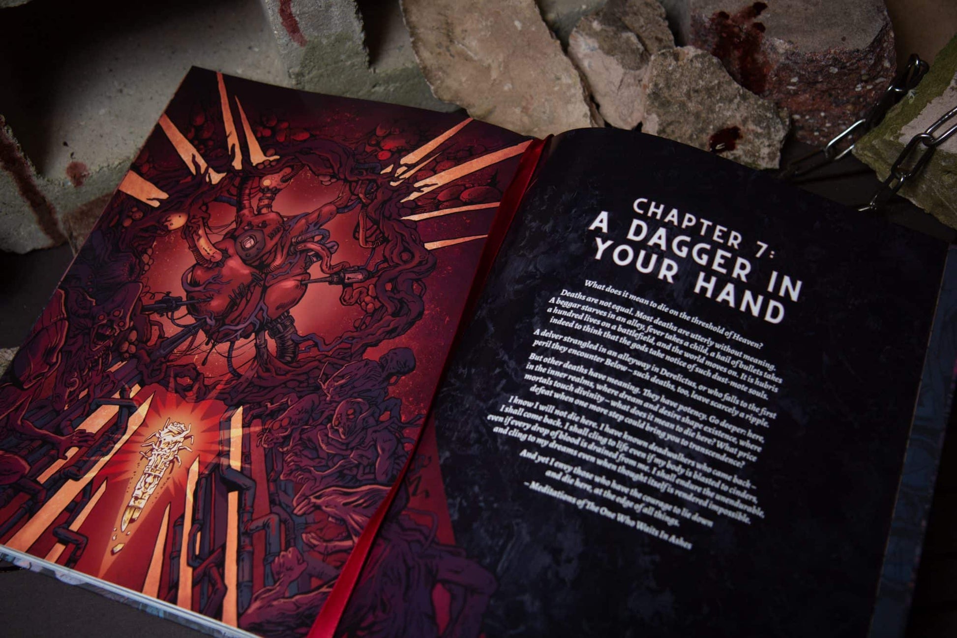 Open book, Chapter 7: A Dagger In Your Hand. Left page has red, visceral illustration of monstrous figures and a glowing dagger