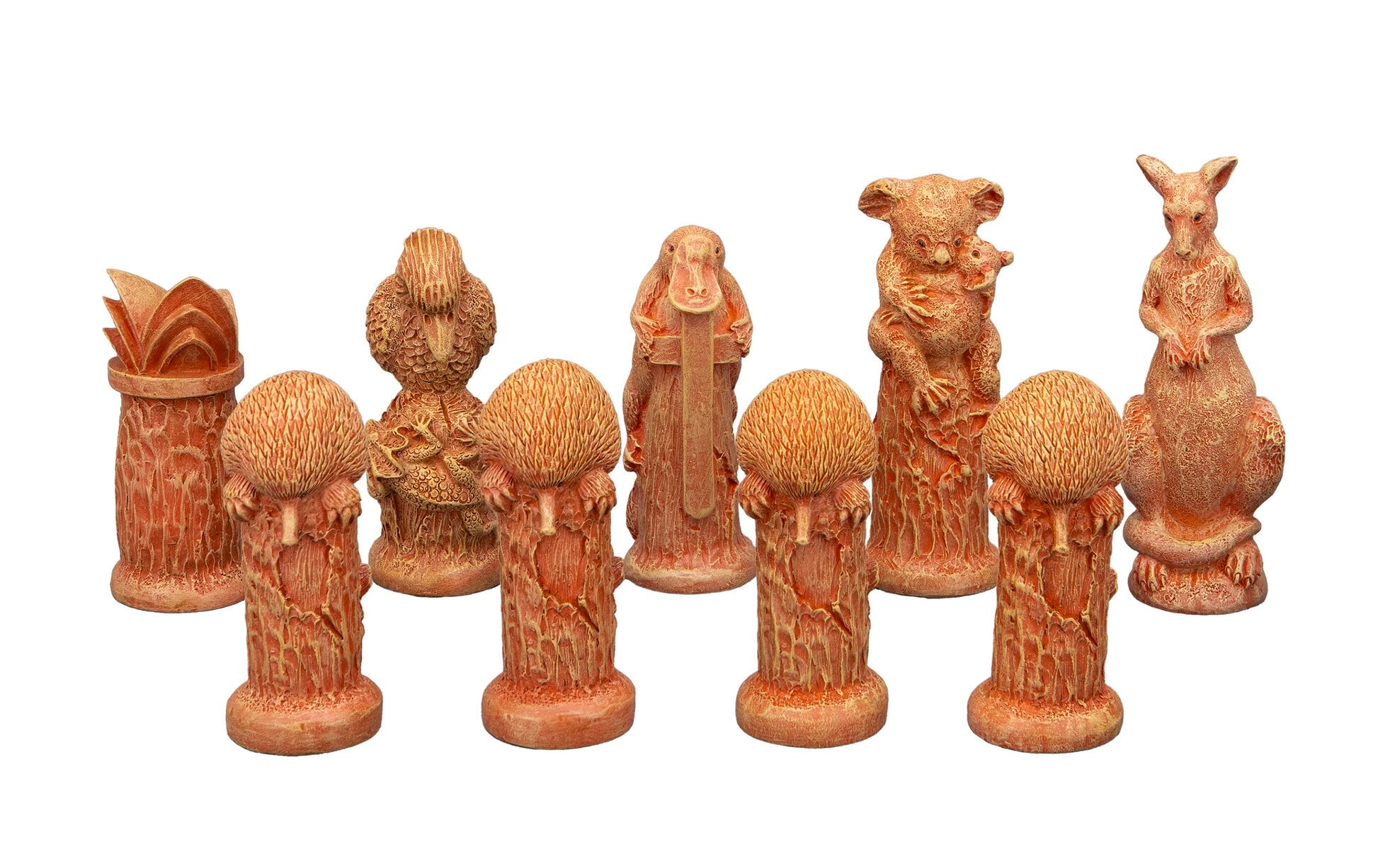 Terracotta Australian animal figurines: kangaroo, koala with joey, platypus, kookaburra, and four echidnas, on white