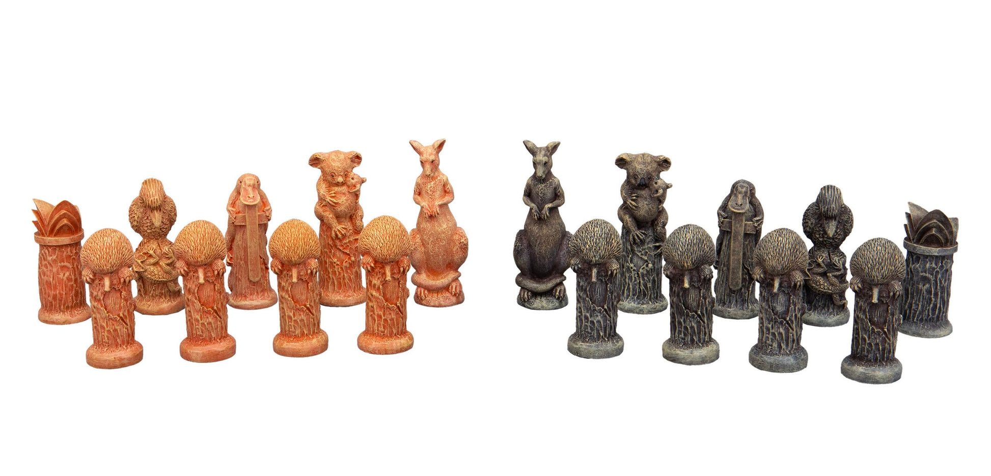 Two sets of intricately carved Australian animal chess pieces, one reddish-brown and one dark grey, arranged in rows