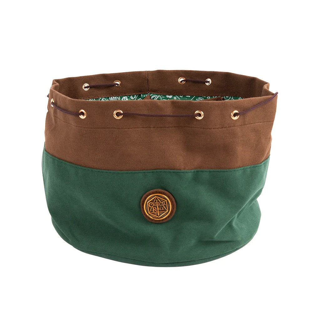 A two-tone brown and green Critical Role Bailey's drawstring dice bag