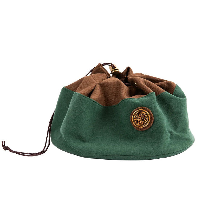 Green and brown drawstring Critical Role dice bag, partially cinched, with a gold logo patch