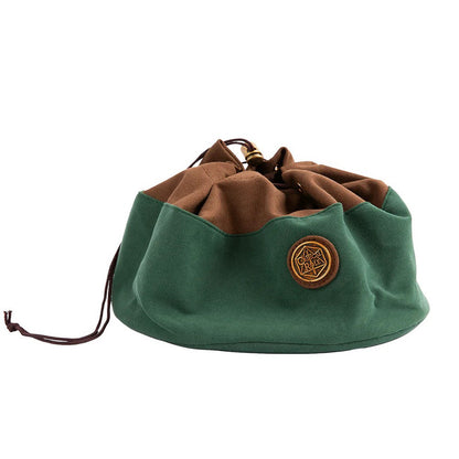 Green and brown drawstring Critical Role dice bag, partially cinched, with a gold logo patch
