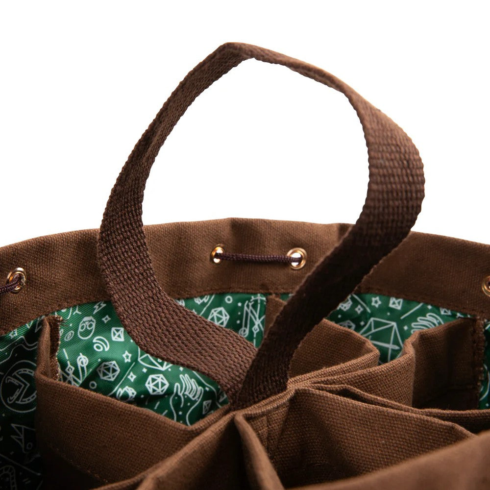Brown canvas organizer dice bag with green TTRPG-patterned interior, multiple compartments, drawstring closure, and handle